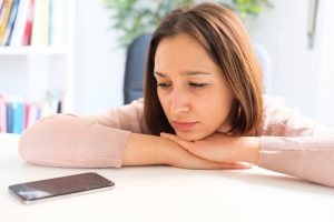 Unhappy client waiting to hear from her lawyer