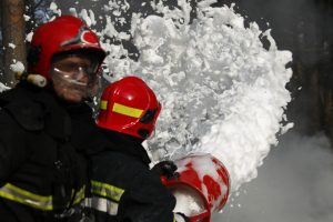 Firefighter using AFFF fire-fighting foam